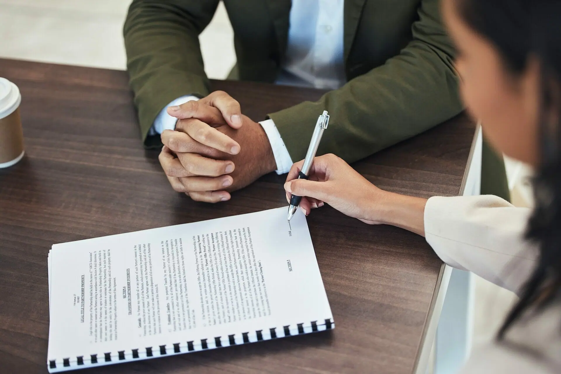 Interview, office and woman signing a document after a corporate job recruitment with human resourc
